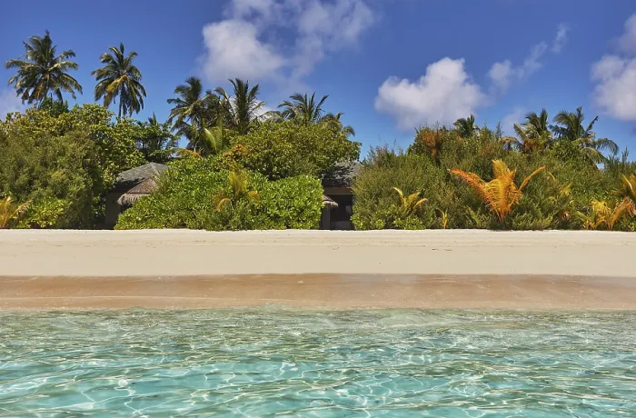 Framed Print : Pristine shallow waters lap against the white coral sand of a tropical beach; Havodda Island, Gaafu Dhaalu atoll, Maldives Framed Print : Pristine shallow waters lap against the white coral sand of a tropical beach; Havodda Island, Gaafu Dhaalu atoll, Maldives