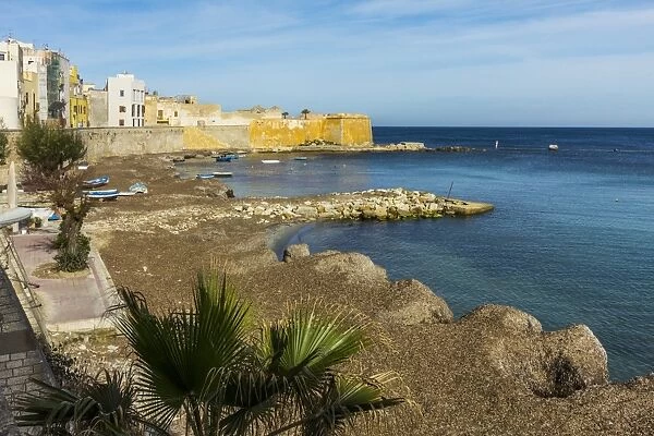 Protected cove and city walls seen from Via Mura Di Tramontana Ovest on sea front of this northwest fishing port, Trapani, Sicily, Italy, Mediterranean, Europe