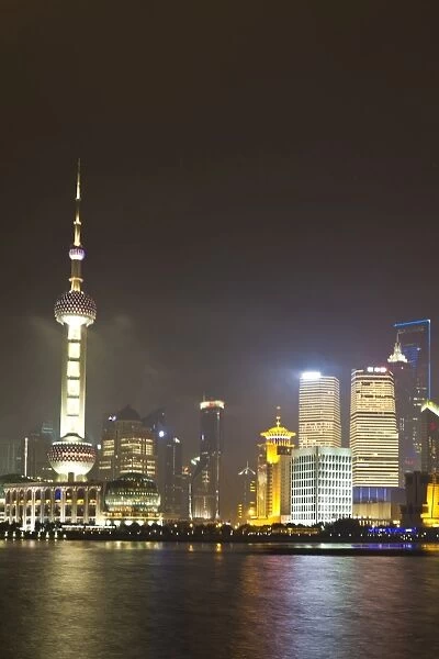 Pudong financial district and Oriental Pearl Tower across the Huangpu River, Shanghai, China, Asia
