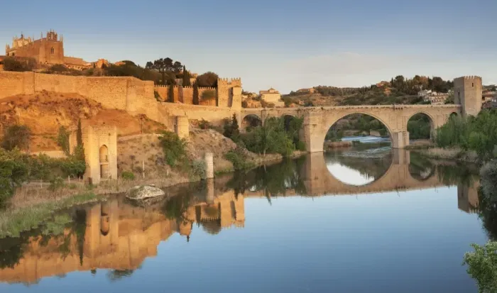 Framed Print : Puente de San Martin Bridge and San Juan des los Reyes Monastery reflected in the Tajo River Framed Print : Puente de San Martin Bridge and San Juan des los Reyes Monastery reflected in the Tajo River