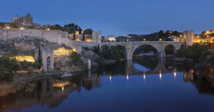Framed Print : Puente de San Martin Bridge and San Juan des los Reyes Monastery reflected in the Tajo River Framed Print : Puente de San Martin Bridge and San Juan des los Reyes Monastery reflected in the Tajo River