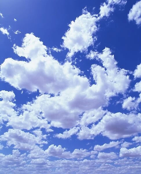 Puffy white cumulus clouds in blue skies over Regans Ford, Western Australia, Pacific