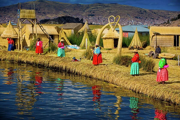 Quechua Indian family on Floating Grass islands of Uros, Lake Titicaca, Peru, South