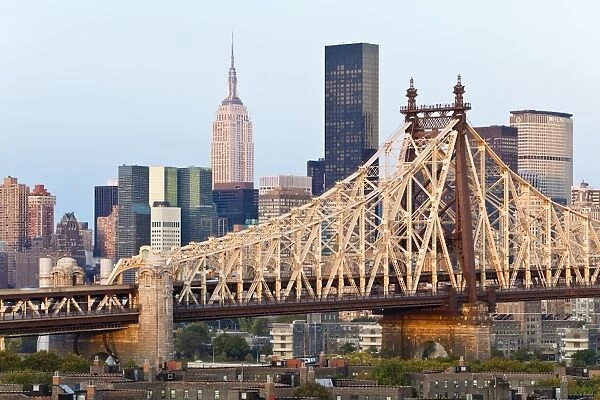 Queensboro Bridge, Manhattan skyline and the Empire State Building viewed from Queens at dawn