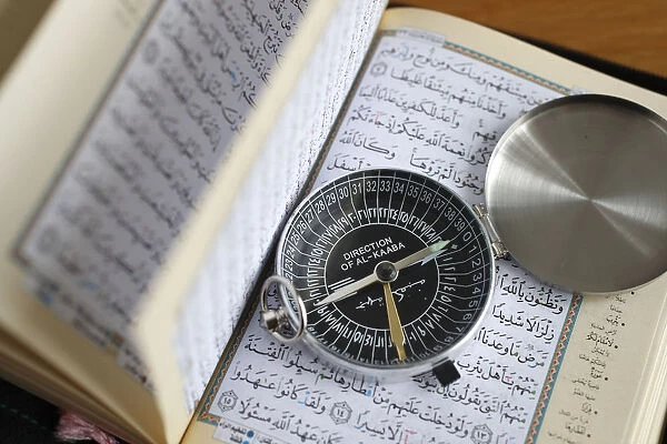 Quran and a Qibla compass to indicate the direction of Mecca, Vietnam, Indochina