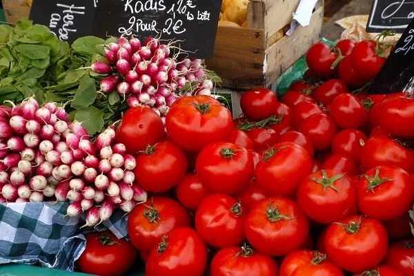 Radishes and tomatoes on a market stall