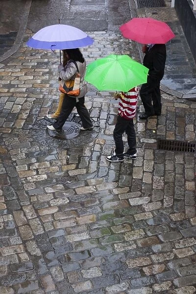 Rain on cobbled street, Seville, Andalucia, Spain, Europe