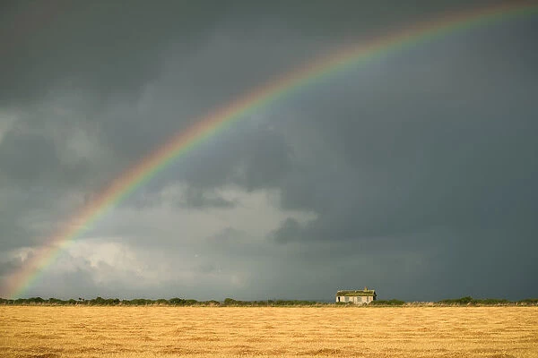 Rainbow over an abandoned cottage on a stormy Scottish Day, Scottish Highlands, United