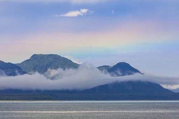 Rainbow colours and low hanging mist over Icy Strait, between Chichagof Island