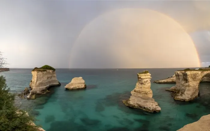Framed Print : Rainbow frames rocky cliffs known as Faraglioni di Sant andrea surrounded by turquoise sea Framed Print : Rainbow frames rocky cliffs known as Faraglioni di Sant andrea surrounded by turquoise sea