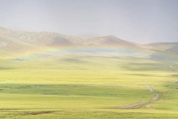 Rainbow over the green Mongolian steppe, Ovorkhangai province, Mongolia, Central Asia