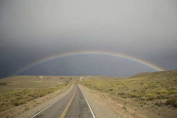 Rainbow above the Pampas and highway, Argentina, South America