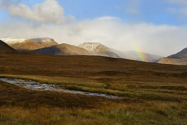 Rainbow over snow capped mountains, Highlands, Scotland, United Kingdom, Europe