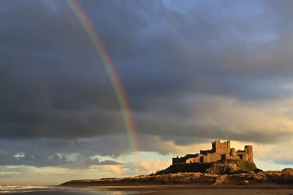 Rainbows end at Bamburgh Castle, Bamburgh, Northumberland, England, United Kingdom, Europe