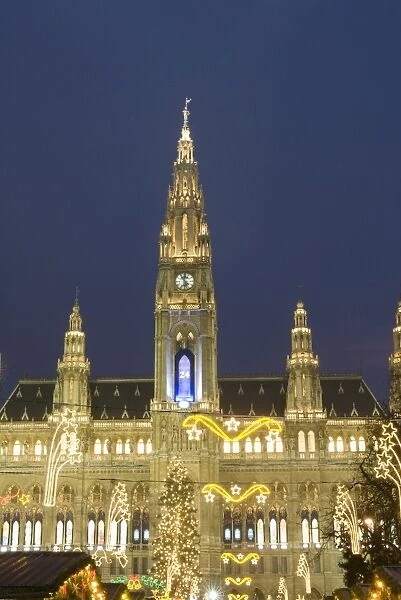 Rathaus (Town Hall) with Christmas decorations at Rathausplatz at twilight