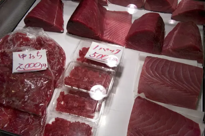 Framed Print : Raw maguro (tuna sashimi) for sale at Tsukiji Wholesale Fish Market, the worlds largest fish market in Tokyo