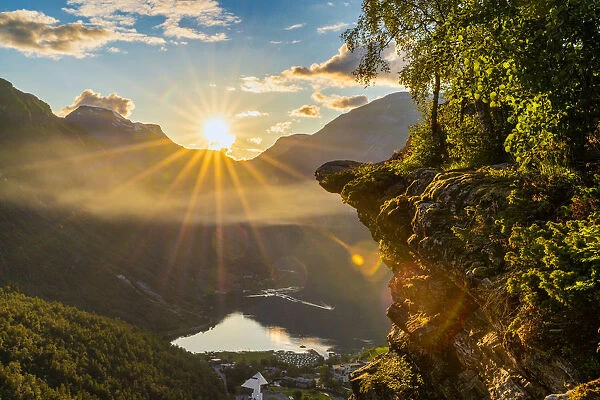 Last rays of sunset over Geiranger village and Geirangerfjord, UNESCO World Heritage Site