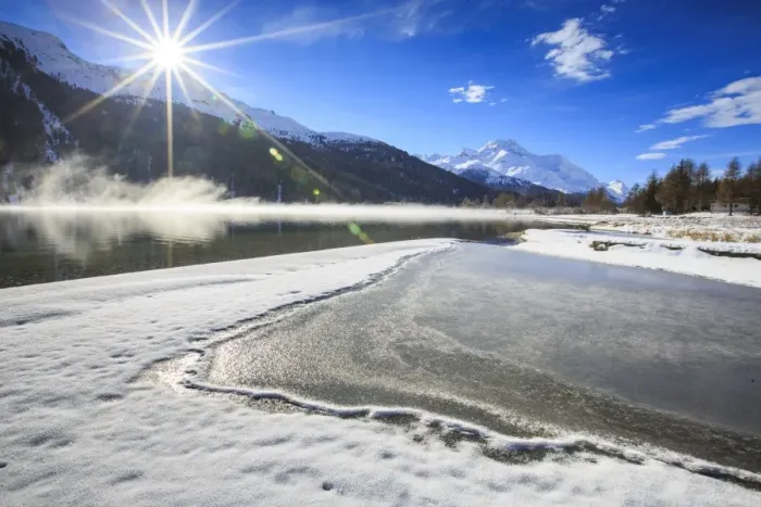 Framed Print : Rays of winter sun illuminate Lake Silvaplana still partially frozen, Maloja, Engadine Framed Print : Rays of winter sun illuminate Lake Silvaplana still partially frozen, Maloja, Engadine