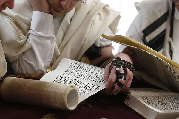 Reading the Book of Esther during Purim celebration in a synagogue, Montrouge