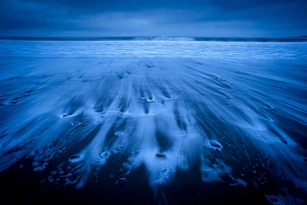 Receding tide at dawn, Oxwich Bay, Gower Peninsula, Swansea, Wales, United Kingdom