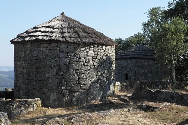Reconstructed round houses in the Celtic hill settlement dating to the Iron Age at Citania de Briteiros, Minho