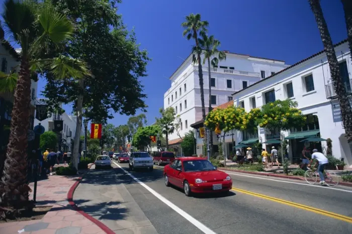 Framed Print : Red car and flowering trees on State Street in Santa Barbara Framed Print : Red car and flowering trees on State Street in Santa Barbara