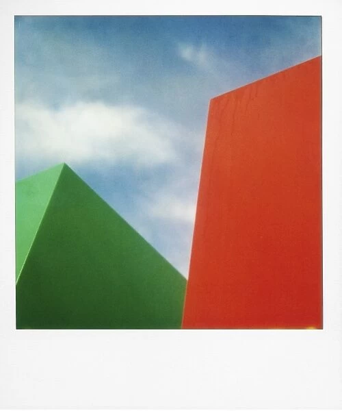 Red and green shapes against sky