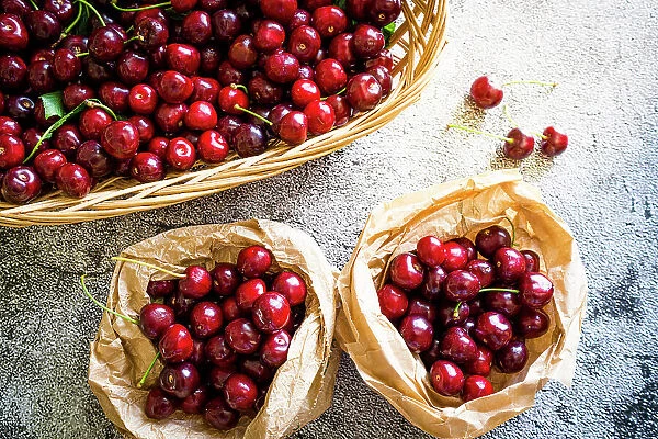 Red organic cherries in baskets ready to eat from above, Italy, Europe