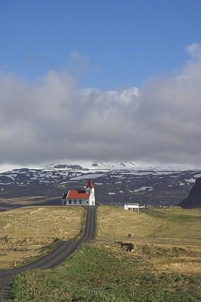 Red roofed white Lutheran Icelandic church at Ingjaldsholl