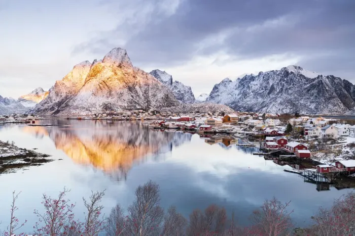 Framed Print : Red Rorbu cabins by the sea with Mount Olstind in the background, Reine Bay Framed Print : Red Rorbu cabins by the sea with Mount Olstind in the background, Reine Bay