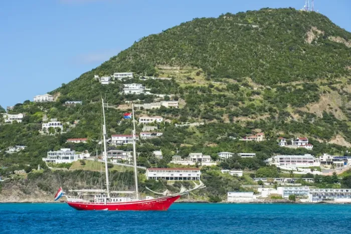 Framed Print : Red sailing boat in the bay of Philipsburg, Sint Maarten, West Indies, Caribbean Framed Print : Red sailing boat in the bay of Philipsburg, Sint Maarten, West Indies, Caribbean