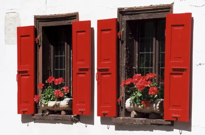 Framed Print : Red shuttered windows and geraniums Framed Print : Red shuttered windows and geraniums
