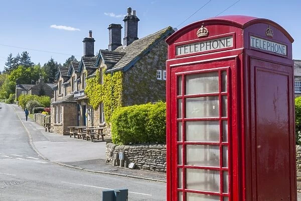Red telephone box in Beeley Village in springtime, Derbyshire Dales, Derbyshire, England