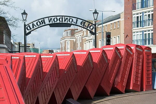 Red telephone box sculpture entitled Out of Order by David Mach, Kingston upon Thames