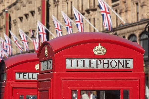 Red telephone boxes opposite Harrods, Knightsbridge, London, England, United Kingdom, Europe