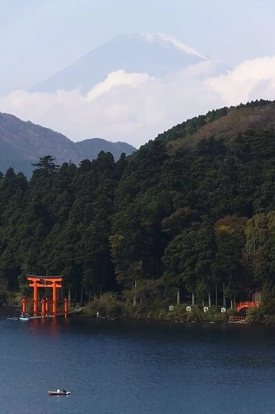 Red Torii Gate on Lake Ashi with Mount Fuji in background