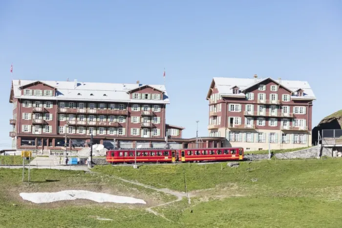 Framed Print : Red wagons of Wengernalpbahn rack railway run next to alpine hotels, Wengen, Bernese Oberland Framed Print : Red wagons of Wengernalpbahn rack railway run next to alpine hotels, Wengen, Bernese Oberland