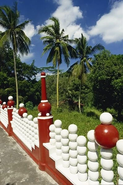 Red and white railings at the Tiger Balm Gardens in Singapore
