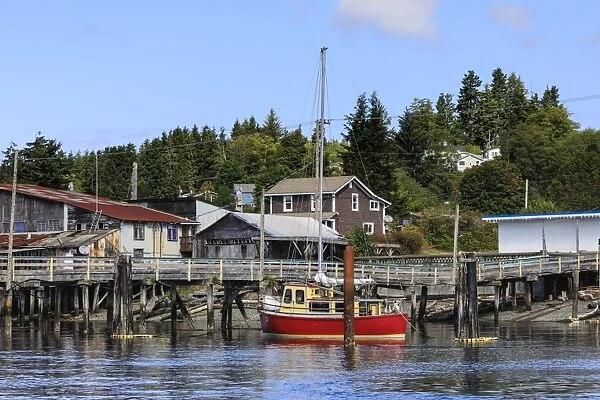 Red yacht, old dock buildings and jetty, Alert Bay, Cormorant Island, Vancouver Island