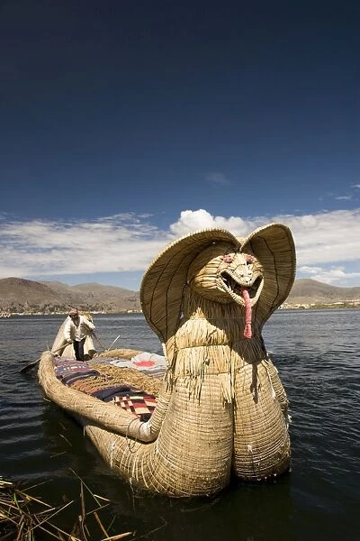 Reed boat with decorative bow, amid floating islands of the Uros people
