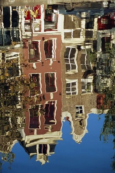 Reflection of Amsterdam houses in canal