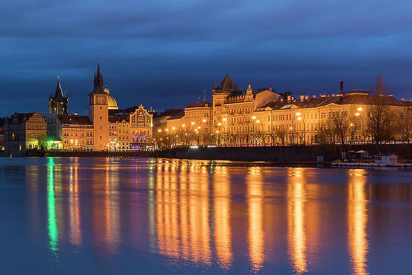 Reflection of Bedrich Smetana Museum and Old Town Waterworks at Smetanovo nabrezi at night, Prague, Bohemia, Czech Republic (Czechia), Europe