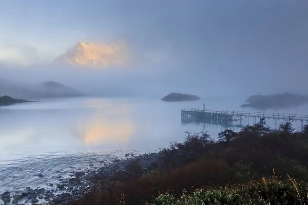 Reflection in the clearing fog, Lago Pehoe, Torres del Paine National Park, Patagonia, Chile, South America