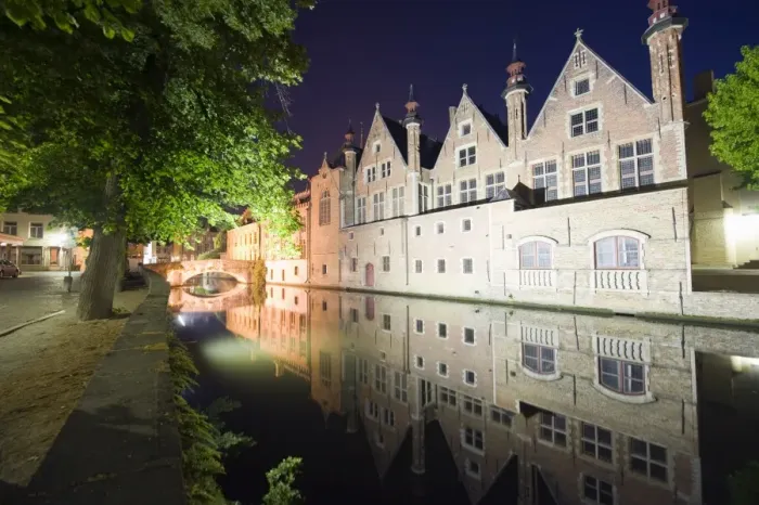 Framed Print : Reflection of houses in a canal illuminated at night, Old Town, UNESCO World Heritage Site