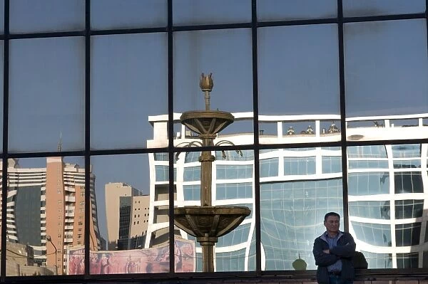 Reflection of modern Astana in a window, Astana, Kazakhstan, Central Asia, Asia