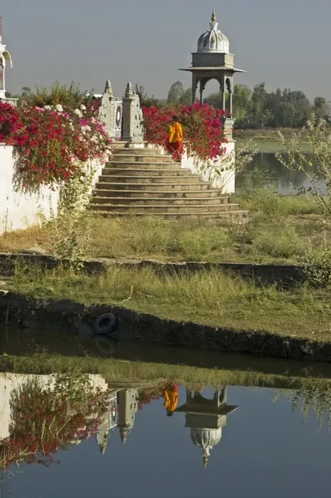 Framed Print : Reflection of monk entering the lake temple for puja at dawn, Dungarpur Framed Print : Reflection of monk entering the lake temple for puja at dawn, Dungarpur