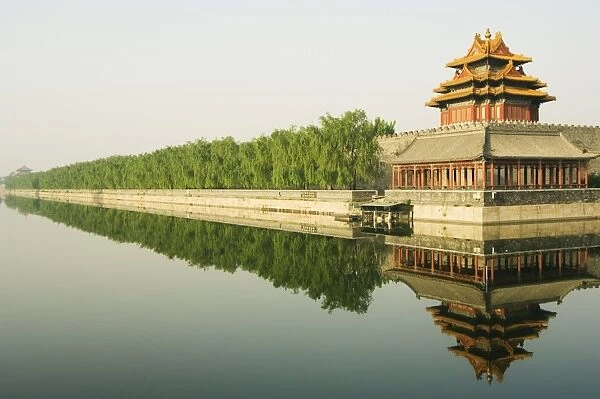 A reflection of the Palace Wall Tower in the moat of The Forbidden City Palace Museum