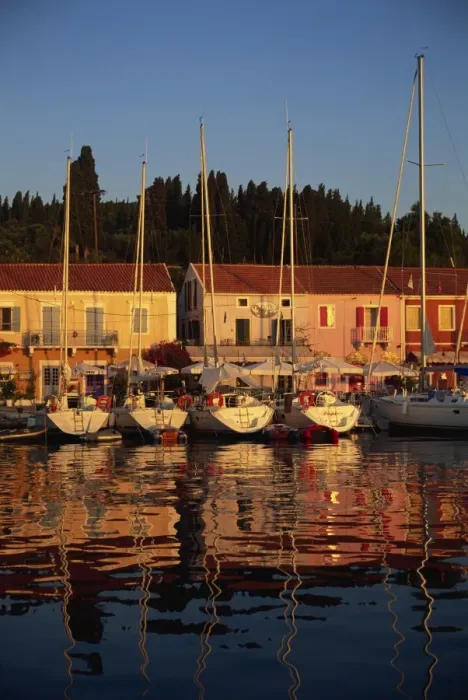 Framed Print : Reflections of boats in the evening at Fiskardo Framed Print : Reflections of boats in the evening at Fiskardo