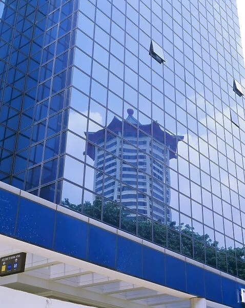 Reflections in a building on Orchard Road