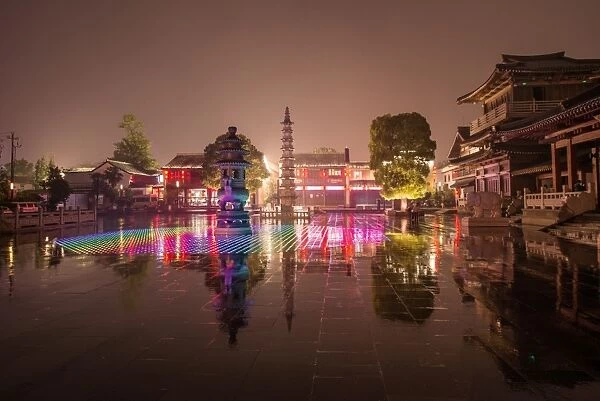 Reflections of LED lighting in the rain at Xiangji Temple, Hangzhou, Zhejiang, China, Asia